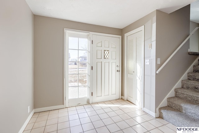 foyer entrance featuring light tile patterned floors