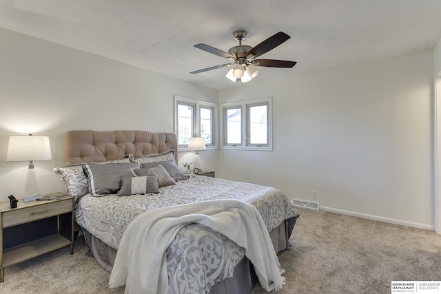 bedroom featuring light carpet and ceiling fan