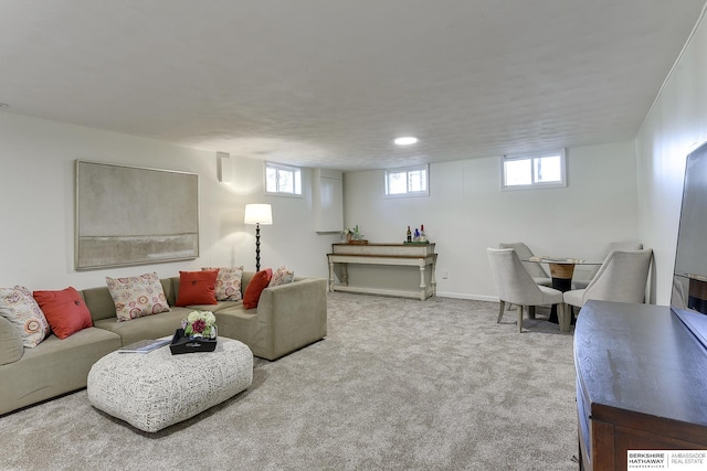 carpeted living room with a healthy amount of sunlight