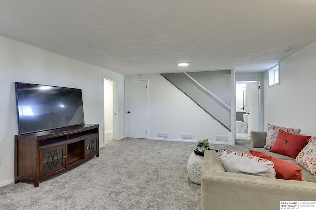 living room featuring light carpet