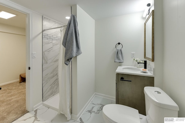 bathroom featuring walk in shower, vanity, and toilet