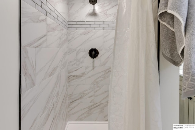 bathroom featuring curtained shower