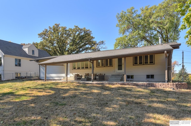 view of front of home featuring a patio, outdoor lounge area, and a front yard