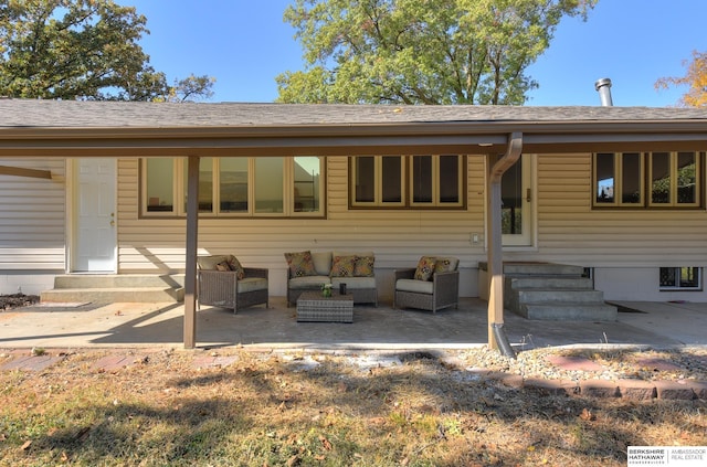 back of house with an outdoor living space and a patio