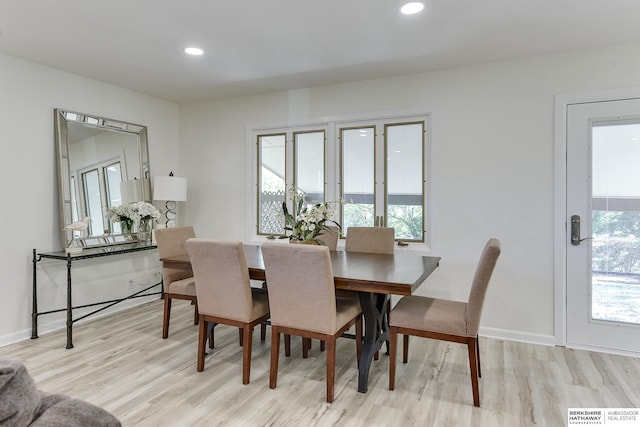 dining area with light hardwood / wood-style flooring