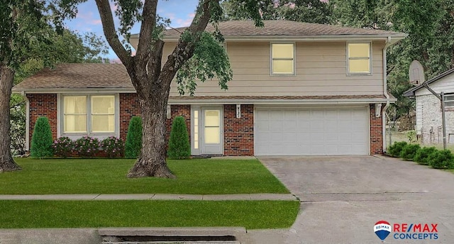 view of front of house with a garage and a front yard