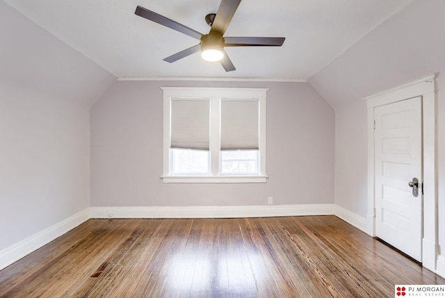 bonus room featuring dark wood-type flooring, vaulted ceiling, and ceiling fan