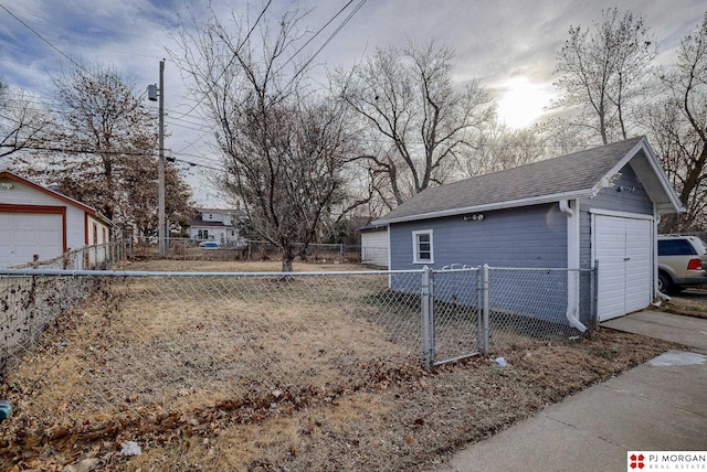 exterior space with an outbuilding and a garage