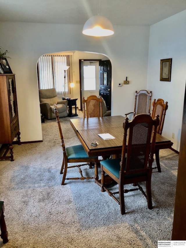 view of carpeted dining space