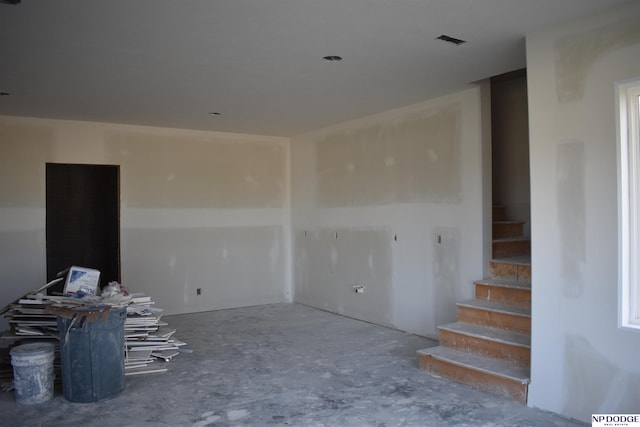 spare room with concrete flooring