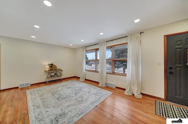 entrance foyer with light hardwood / wood-style floors