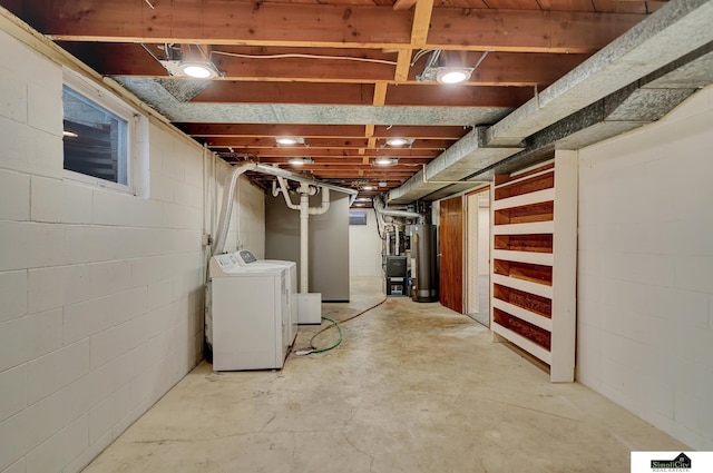 basement with gas water heater and washer and dryer