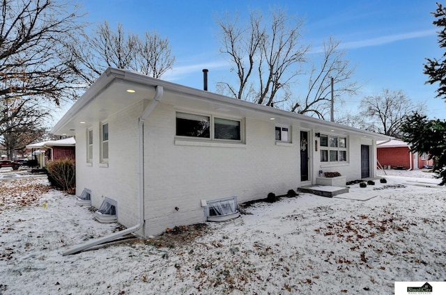 ranch-style home featuring ac unit