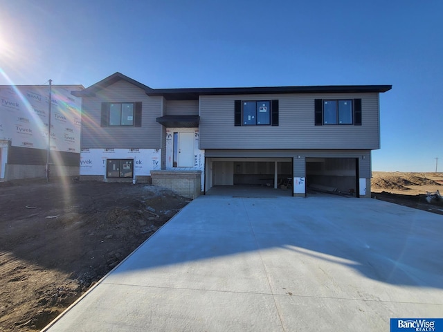 raised ranch featuring a garage