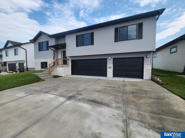 bi-level home featuring a garage