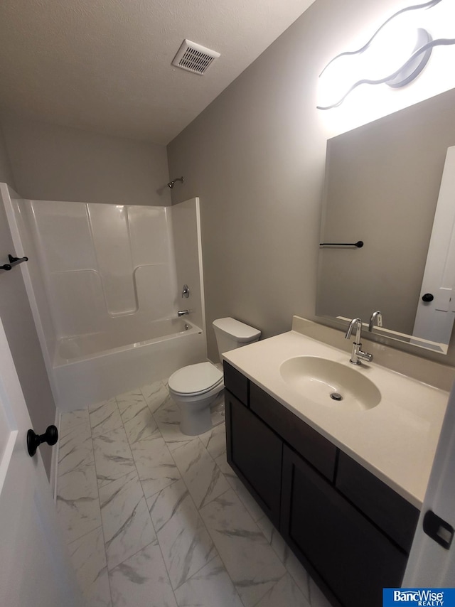 full bathroom featuring vanity, tub / shower combination, and toilet