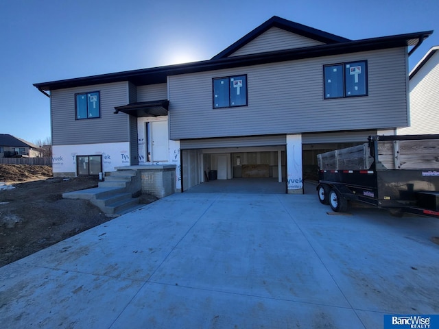 view of front of home featuring a garage and driveway