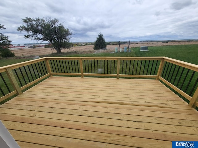 wooden terrace with a yard