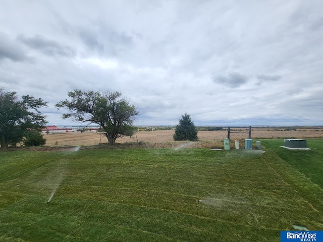 view of yard with a rural view