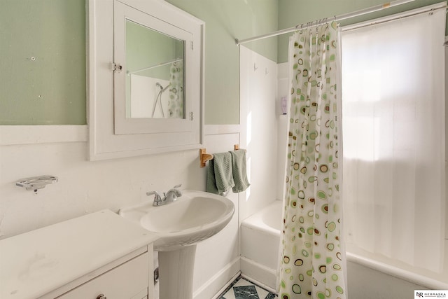 full bathroom with a sink and shower / bathtub combination with curtain