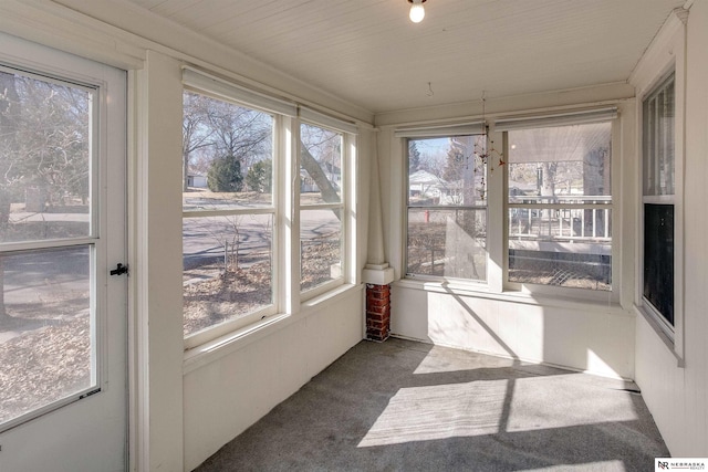 unfurnished sunroom featuring a healthy amount of sunlight