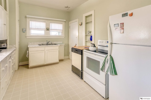 kitchen with white appliances, baseboards, light countertops, and a sink