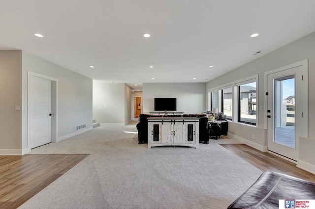 living room featuring light carpet