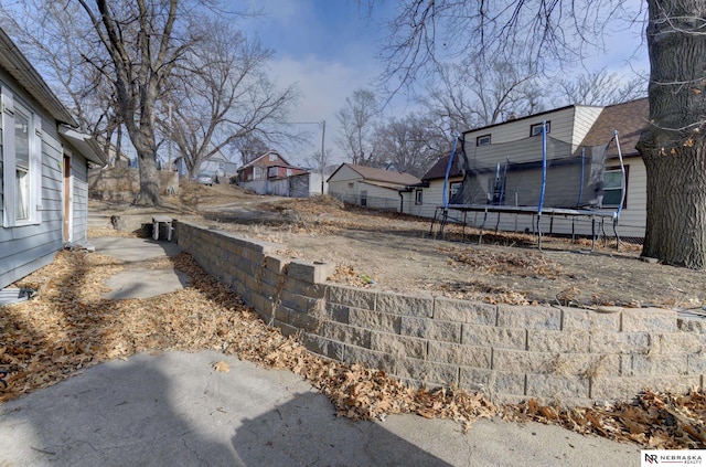 view of yard with a trampoline