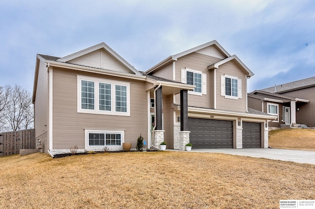 view of front facade featuring a garage and a front yard