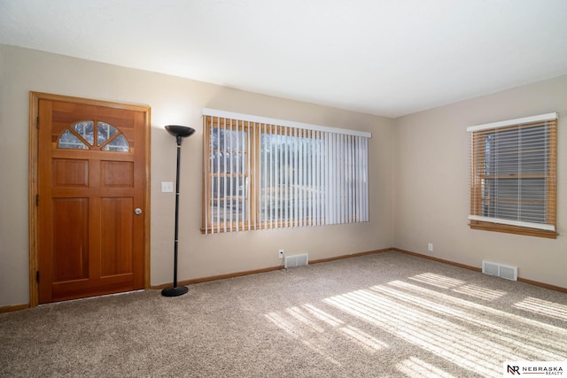 entryway with carpet floors