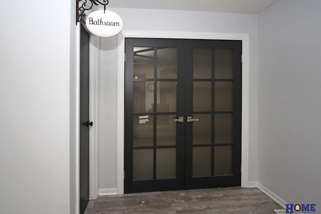 room details with hardwood / wood-style floors and french doors