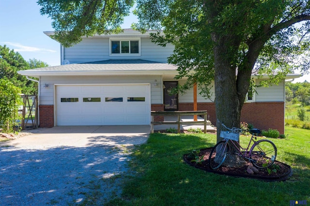 view of front of home featuring a garage and a front lawn