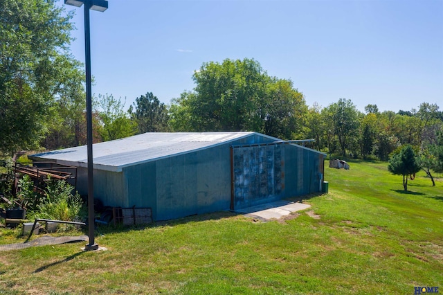 exterior space with a yard and an outdoor structure