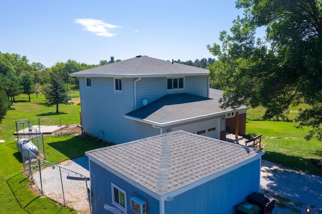 back of house featuring a lawn