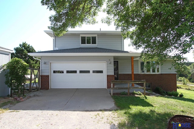 view of front of house with a garage and a front lawn