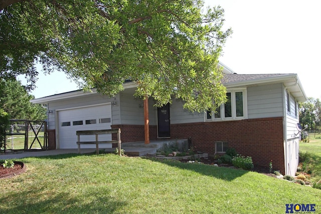 view of front of property with a garage and a front lawn