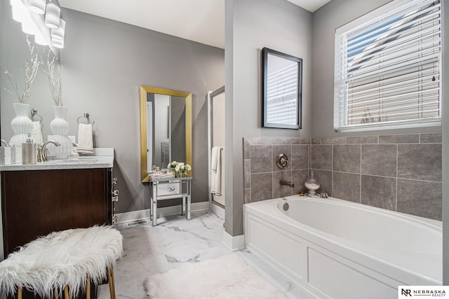 bathroom with vanity and independent shower and bath