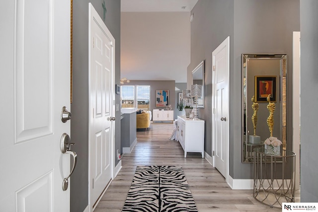 hall with light hardwood / wood-style floors