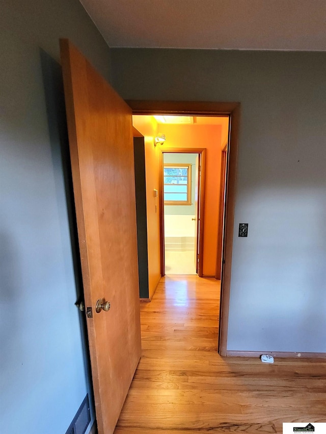 hallway featuring light wood-type flooring