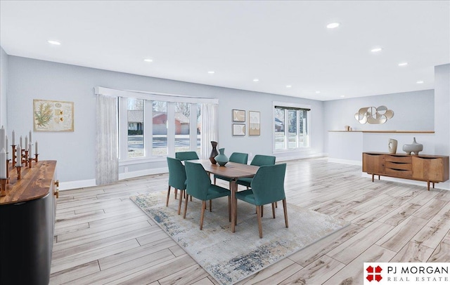 dining space with light hardwood / wood-style floors