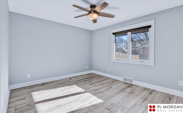 empty room with light wood-type flooring and ceiling fan