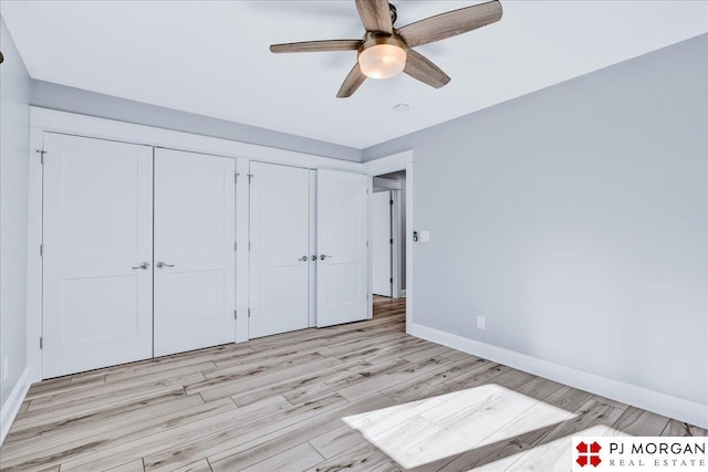 unfurnished bedroom with light wood-type flooring and ceiling fan