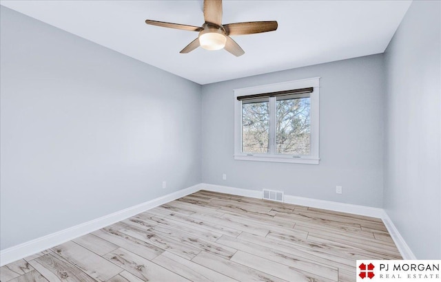 unfurnished room with ceiling fan and light wood-type flooring