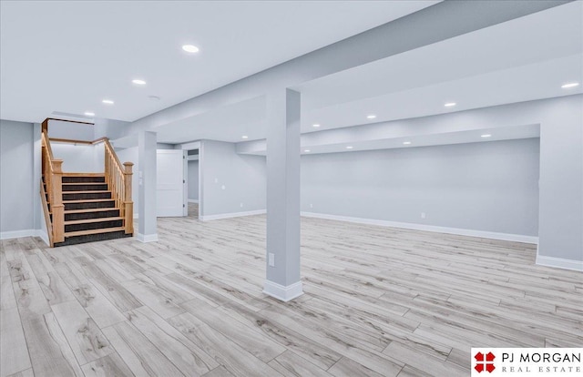 basement with light hardwood / wood-style floors