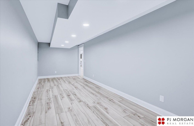 basement featuring light wood-type flooring