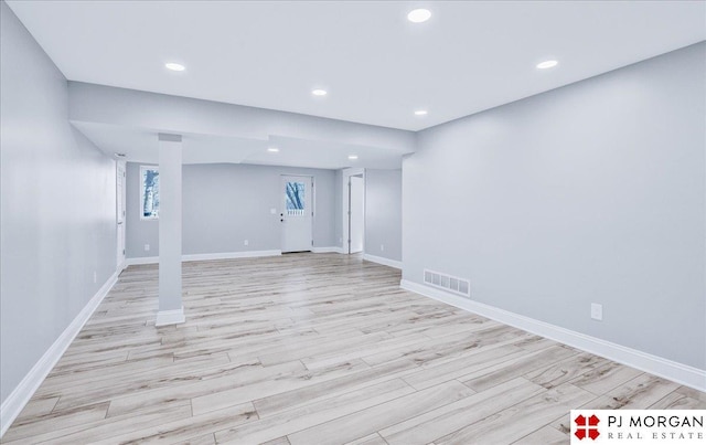 basement featuring light hardwood / wood-style flooring