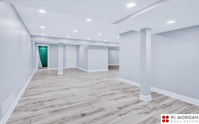 basement featuring light hardwood / wood-style flooring