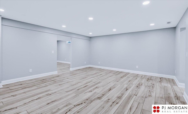 spare room featuring light hardwood / wood-style floors