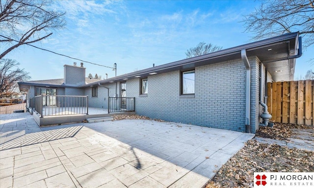 back of property featuring a patio area