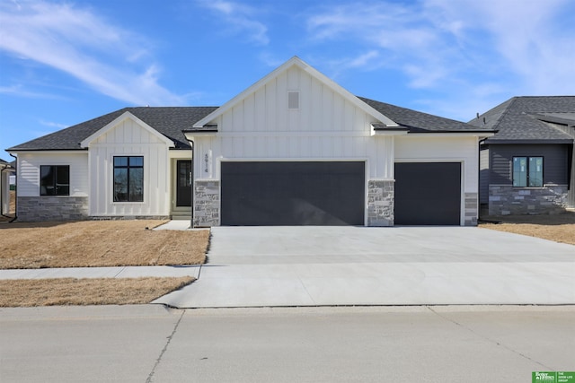 modern inspired farmhouse featuring a garage